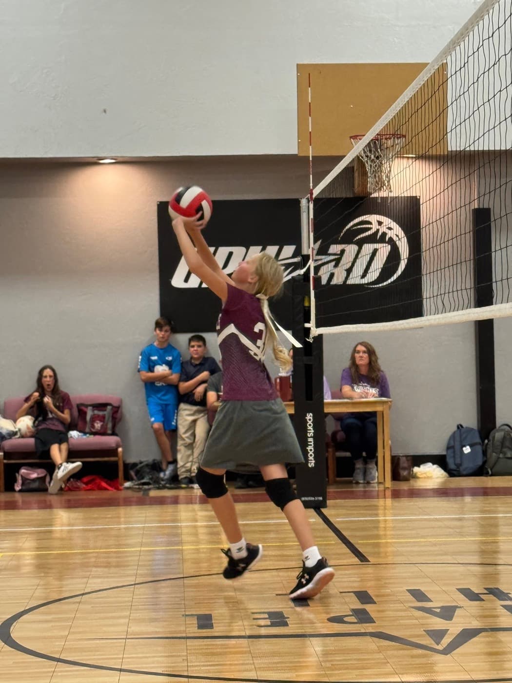 An Elmwood Eagles player rising for a set at the net